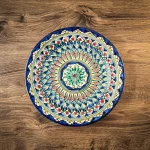 Handcrafted Uzbek ceramic plate Mekhrob with traditional blue patterns