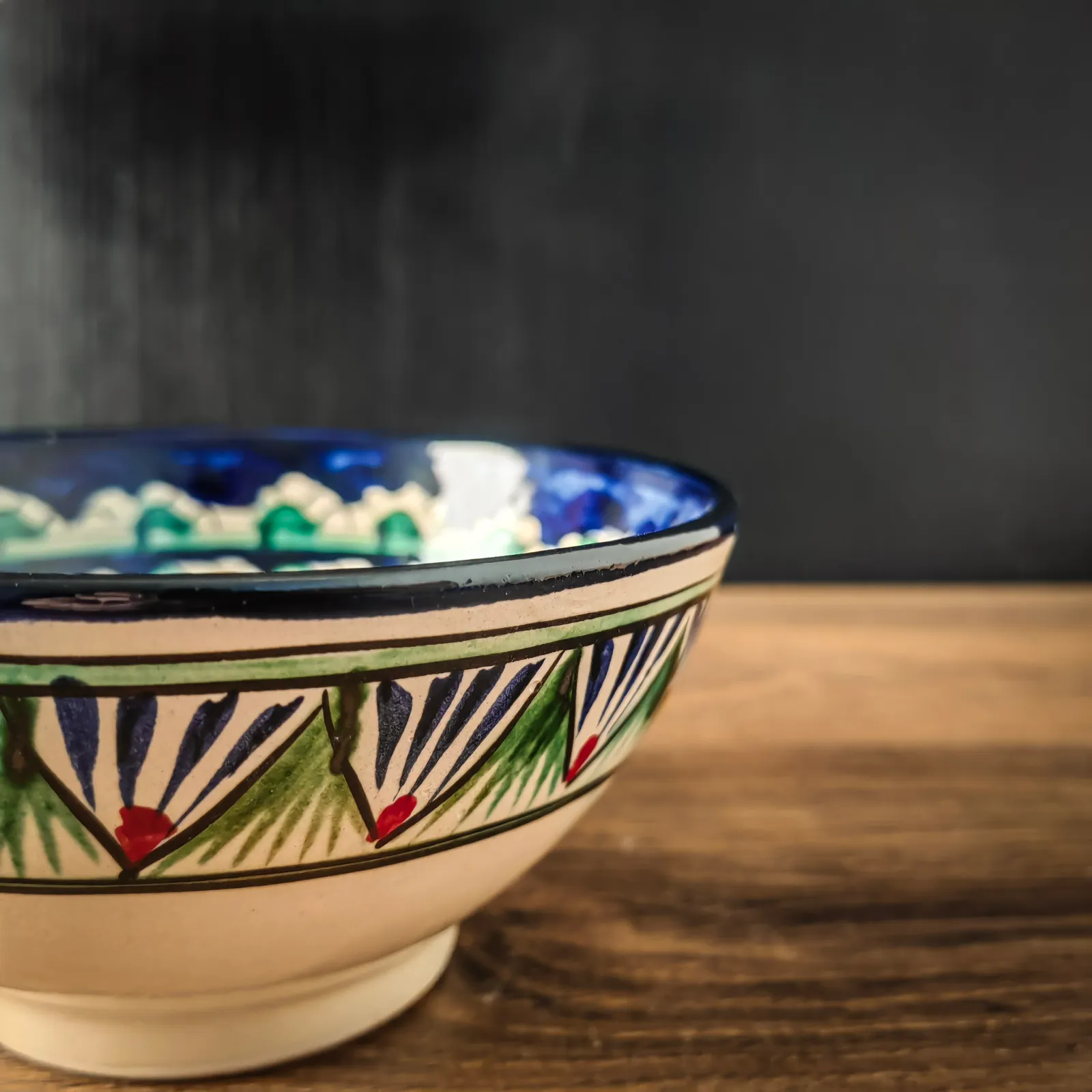 Colorful Uzbek ceramic bowl with traditional oriental ornament pattern