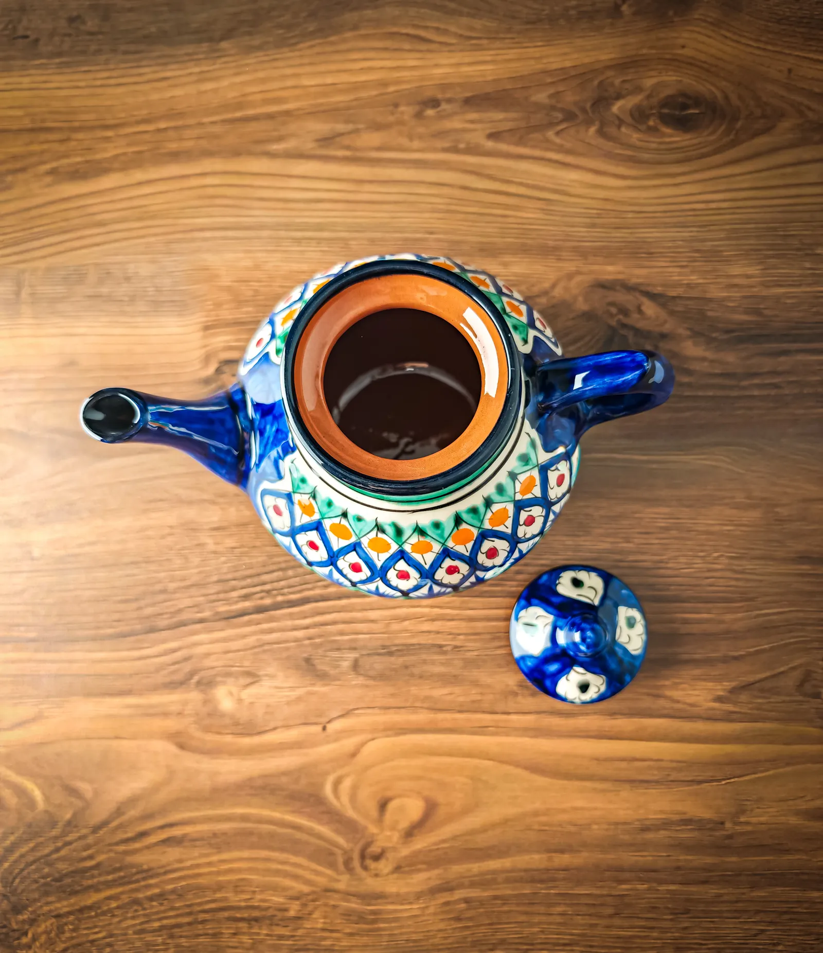 Uzbek ceramic teapot with traditional hand-painted pattern